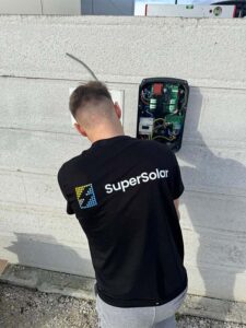 Technician installing EV charger.